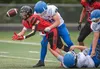 Houston running back Elias Johnson flips the ball back to quarterback Blake Baskett as he is hit during a two-point conversion attempt. Baskett took the ball and hit the end zone to convert t
