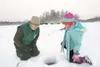 ROBERT DeBERRY/Frontiersman Alaska Department of Fish and Game
fisheries biologist Sam Oslund and Valley Christian School student
Alina Udodik wait for the fish to begin bitting Thursday duri