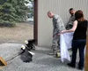 130511-F-IY975-003: JOINT BASE ELMENDORF-RICHARDSON, Alaska – Tech. Sgt. Timothy Ayers, 3rd Munitions Squadron, Master Sgt. Vic Rounds, 381st Intelligence Squadron, and Michelle Carpenter, 67