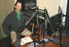 KNLT radio advertising account exectuive and deejay Michael Consalo poses for a photo in the station’s control room Friday, Feb. 5. STEVEN MERRITT/Frontiersman