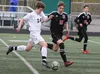 Colony’s Eli Krozel moves the ball past defenders during a tie against Kenai. Tim Rockey/Frontiersman