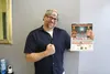 Alaska Combat Entertainment owner Billy Christensen shows the poster to the upcoming show Friday. Jacob Mann/Frontiersman