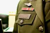 “U.S. Army Sgt. Major Ashleigh Sykes, Army Uniform Policy Branch SGM wears a nameplate, with her Army AGSU uniform, now authorized by Army policy.” (U.S. Army photo by Maj. Angel L. Tomko)