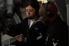 Mass Communication Specialist Seaman Apprentice Karli Wilkerson, from Big Lake, Alaska, left, and Master Chief Logistics Specialist Keith Adams, from Houston, Texas, provide commentary during