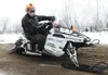 Aaron Loyer speeds around a snow and dirt berm during the first
few minutes of the 2010 Iron Dog Snowmachine Race. (ROBERT
DeBERRY/Frontiersman)