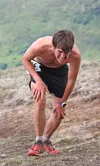 Palmer High School graduate Cody Priest grinds to the top of Government Peak during the 2016 race on Saturday, June 4. Priest, now a cross country running coach for Chugiak High School, is pa