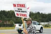 Members of Local 367 Plumbers and Steamfitters picket outside Enstar offices along Palmer-Wasilla Highway Monday. Union membership went on strike at 6 a.m., Monday, citing company tactics and