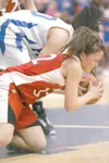 ROBERT DeBERRY/Frontiersman Wasilla Warrior Celeste Colegrove
amd Palmer Moose Ashley Swetzof scramble to take posession of a
loose ball during Saturday's game at Palmer High School. The
Warr