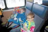 Hunter Hooser and Kodi Swanson curl up with good books for the train ride. Submitted photo