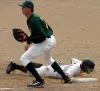Anchorage infielder Ben Zeskind slides back into first base
after Mat-Su pitcher B.J. Church makes the throw back to first
baseman Matt Edwards. Photo by JEREMIAH BARTZ/ Frontiersman.