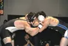 Palmer senior Caleb Deemer locks up with Kodiak's Kerry Powers during the 195-pound final of the Northern Lights Conference Championships. Deemer won the match in overtime to win his first re