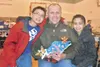 Travis, Larry and Kia Bekkedahl pose with their salmon. (Photo
courtesy Shaw Elementary School)