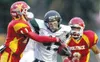 ohn Wagner/Fairbanks Daily News-Miner Colony’s Skye Rench,
center, tries to fend off a tackle from West Valley’s Willie G.
Clark Jr., left, during Friday evening’s game at West Valley High
Sc
