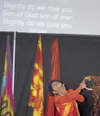 Many participants at a national prayer gathering at the Curtis
D. Menard Memorial Sports Center Friday and Saturday felt
physically moved to dance and reach out in prayer as a ministry
band f