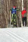 Colony High School sophomore Dawson Knopp crests a hill in Thursday’s 7.5-kilometer classic race of the 2015 ASAA/First National Bank State Nordic Skiing Championships at Kincaid Park. Knopp 