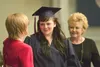 Denali Ann Jacobsen gets a congratulation from American Charter
principal Becky Huggins Monday evening at the schools first high
school graduation. There were 35 graduates in the 2011 class.
