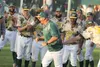 Mat-Su Miners head coach Ben Taylor celebrates after he is doused with a bucket of water moments after the Miners used a 7-1 win over the Anchorage Bucs to win the 2017 Alaska Baseball League