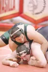 ROBERT DeBERRY/Frontiersman Colony junior Renn Wright, top,
wrestles against Wasilla'€™s Ryan Pomrenke in the 285-pound weight
class Friday in the North/South Duals at Wasilla High School.