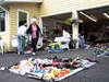 Janet Foldenauer leaves a garage sale Friday near the Seward
Meridian Parkway with Christmas decorations, among other purchases.
Summertime garage sales draw out local treasure hunters who ea