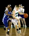 Colony’s Joe Gray works his way down the floor past Bartlett’s Andre Berry during the final minutes of Colony’s 87-49 loss to the defending state champions in the first round of the ASAA/Firs
