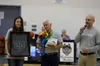 Delaney Reavis holds a framed jersey as Redington Jr./Sr/ High School retires the No. 20 in honor of her mother Angela Coyne Reavis, a former Redington teacher and coach who lost her battle w
