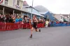 Christy Marvin of Palmer sprints down the pavement as fans cheer during the annual Mount Marathon race in Seward Saturday. Marvin finished third in the women’s class, with a time of 52 minute