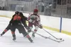 Wasilla's Garrett Conroy beats a pair of West Anchorage blueliners to the corner during the first game of the Palmer Hockey Showdown Nov. 12 at the MTA Events Center in Palmer. JEREMIAH BARTZ