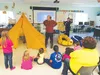 Brettwood “Hig” and Erin McKittrick, who trekked through the proposed site of a coal mine at Wishbone Hill, tell children at the Ya Ne Dah Ah School in Sutton what they found. HEATHER RESZ/Fr