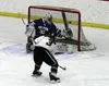 Colony forward Alex Fike knocks the puck into the Palmer net during an 8-2 win over the Moose Friday at the Menard Arena in Wasilla. The goal was created by an odd-man rush led by Otto Thiele
