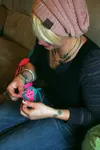 Knik House resident Jessica Haag crochets a blanket for her nine-year-old daughter, who now lives with Haag's grandparents, on Oct. 2. Haag said she used to think she was 'more creative on do