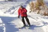 Pioneer Ski Patrol member Dave Hendrickson carves down the slope
at Hatcher Pass Saturday afternoon. Winter Trails Day provided
people an opportunity to learn Nordic and downhill skiing,
snow