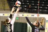 Palmer junior Sammy Buresh, left, tries to knock the ball over the reach of Colony senior Mackenzie Everett during Palmer's 3-0 win over Colony on the second day of the ASAA/First National Ba