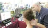 ROBERT DeBERRY/Frontiersman Wasilla resident Clatrina Menaker
gets a computerized chiropractic consultation from Dr. Christopher
V. Garden Friday afternoon at the Fall Home Show at the Wasill