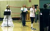 Teeland Middle School National Junior Honor Society students Maddie Covey, Amalia Hunt, Serena Heck (at microphone) and Kyra Fagerstrom (at podium) carry out an anti-drug skit at an assembly 