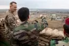 Maj. Gen. Sirwan Barzani, a Peshmerga commander, shows U.S. Army Col. Scott Holden, Kurdistan Coordination Center director, the town of Gwer which was at one point under the control of Daesh 