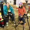 Adriane Weatherby from Tundra Toes with friend Alex Colt was on hand showing visitors how to use the circular sock knitting machine during the 2022 Alaska Fiber Arts Festival