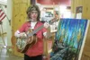Nicolas McCaslin, a Beatles fan extraordinaire, performs his favorite tunes outside B Bella in the Koslosky Center for this month's Palmer Art Walk. Caitlin Skvorc