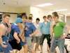 Courtesy photo Male high school students “Walk a Mile in Her
Shoes” during a recent exercise to better understand domestic
violence. Administrator