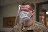 U.S. Air Force Master Sgt. Devin Long, 8th Civil Engineer Squadron explosive ordnance disposal flight chief, dons the second prototype of the protective plastic face shield at Kunsan Air Base