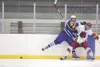 ROBERT DeBERRY/Frontiersman Palmer’s Blake Ervin puts West
Valley’s Dylan Blankenship into the boards during Friday’s game at
the 2011 First National Cup State Hockey Championships at the
Cur