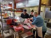 Alaska's Best Phillys owner Laura Christou, right, works with her staff at her new downtown Palmer location Monday, Oct. 19. Jacob Mann/Frontiersman