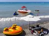 Public beach is in district Lazarevskoye on coast of Black Sea. Tourists are offered various attractions, boat trips. Rescue service ensures safety of people.