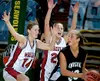 Wasilla's Marsha Schirack and Chandice Cronk, below, defend
Chugiak's Ashley Adams during the second half of the 4A state
championship game Saturday.WILLIAM WOODY/ Frontiersman