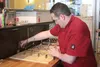 New Downtown Deli owner Kevin Brown cuts dough for croissants in the kitchen of the restaurant on Friday, May 13, 2016. Brown took over the popular Palmer eatery on April 1. STEVEN MERRITT/Fr