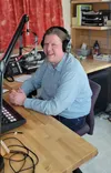 General Manager Phillip Manning does a stint on the air in the KTNA radio studio in Talkeetna. Photo courtesy of KTNA radio