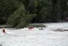 Rescue teams traverse rough waters in the Matanuska River late Tuesday night searching for a woman and child who had fallen into the water near the Old Glenn Highway Bridge earlier in the eve