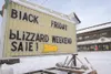 Signs along the Parks Highway advertise Black Friday sales to
try and entice shoppers into their store on one of the busiest
shopping days of the year. (ROBERT DeBERRY/Frontiersman) Robert De