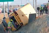 A Head Start bus sits on its side in the ditch near Kenai Supply Road and the Parks Highway Tuesday afternoon. There were no children onboard but the driver was transported to Mat-Su Regional