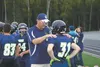 Redington head coach Tony Brooke gives some last minute instructions to running back Isaiah Hall Friday prior to the Huskies’ varsity opener against Monroe Catholic Friday, Aug. 12, 2016. STE