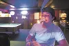 A bar patron at Klondike Mike's Dance Hall and Saloon in Palmer lights up a cigar. Palmer voters will decide in October a proposal to ban smoking at bars in city limits. Robert DeBerry/Fronti